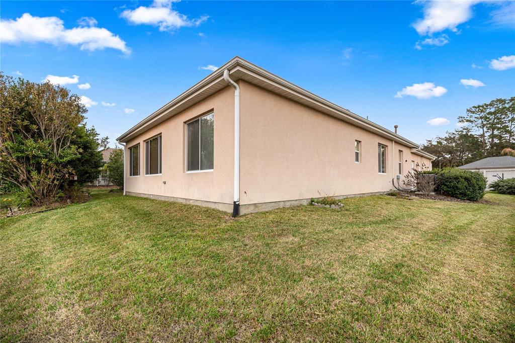 9512 Southeast 124th Loop Summerfield, FL 34491 - Photo 34 of 76 a view of an house with backyard space and garden