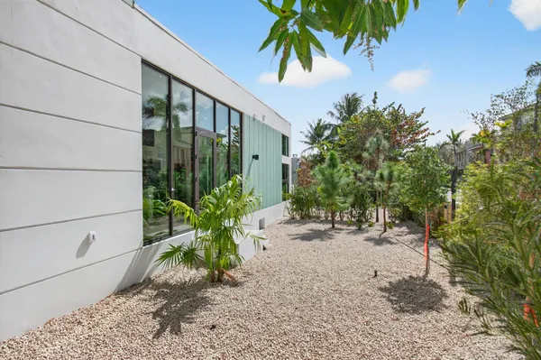 a view of a yard with a potted plants