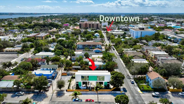 an aerial view of residential houses and outdoor space