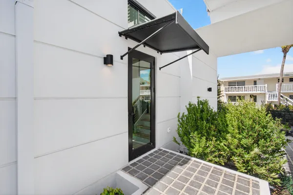 a kitchen with a refrigerator and a stove top oven