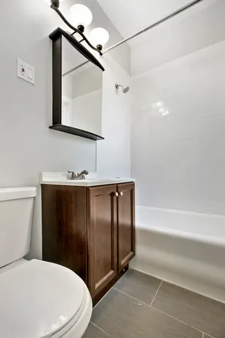 a living room with furniture pool table and a large window