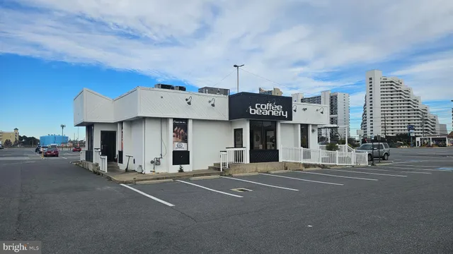 a swimming pool view with a outdoor seating
