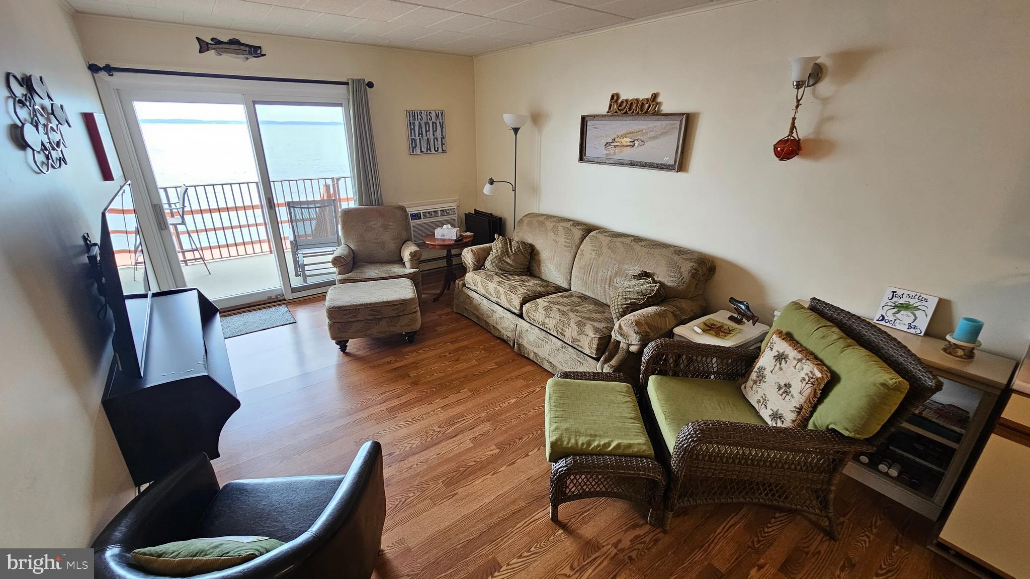 745 Mooring Road, Unit 111 Ocean City, MD 21842 - Photo 7 of 24 a living room with furniture and a window