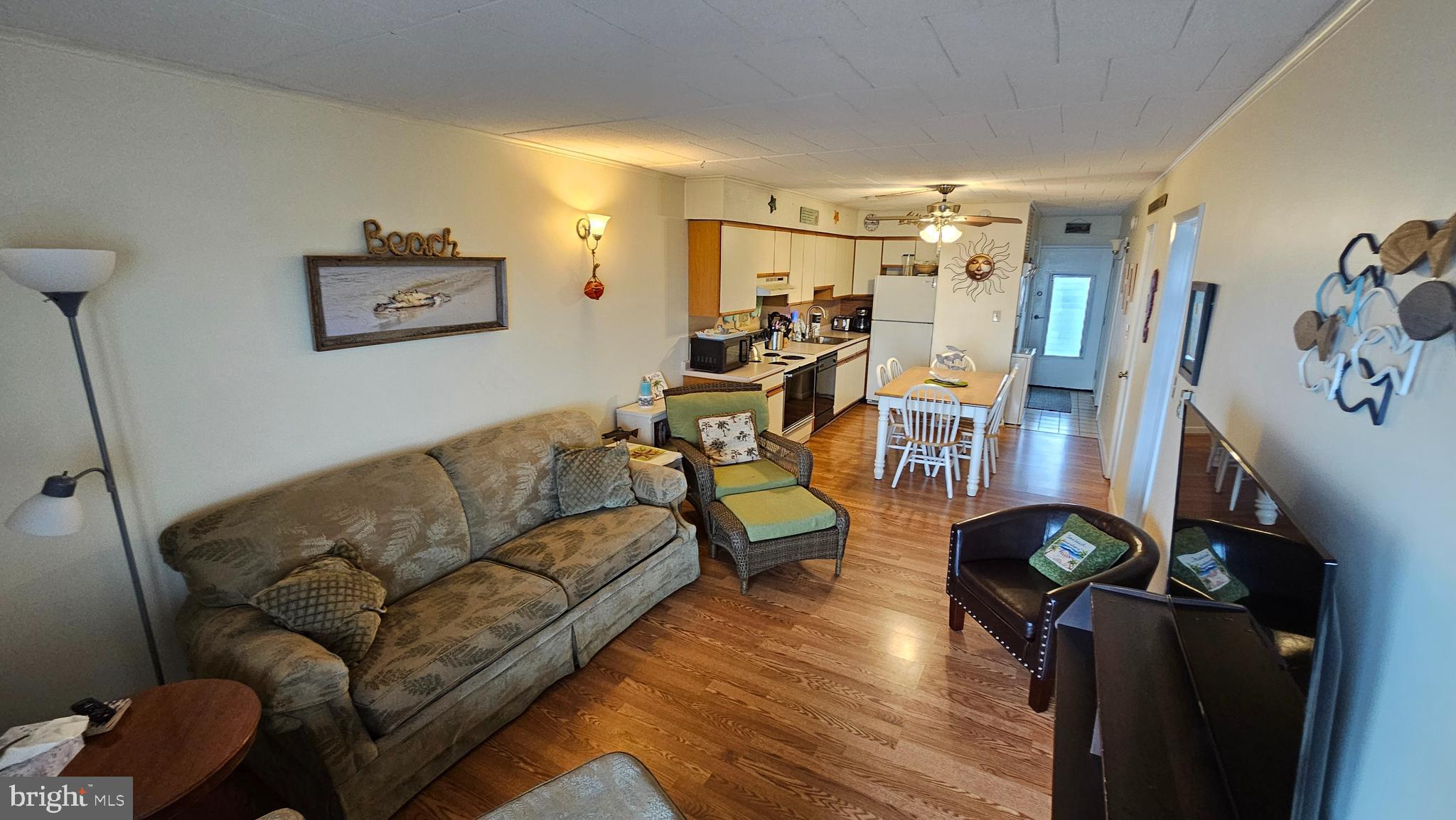 745 Mooring Road, Unit 111 Ocean City, MD 21842 - Photo 8 of 24 a living room with furniture and wooden floor