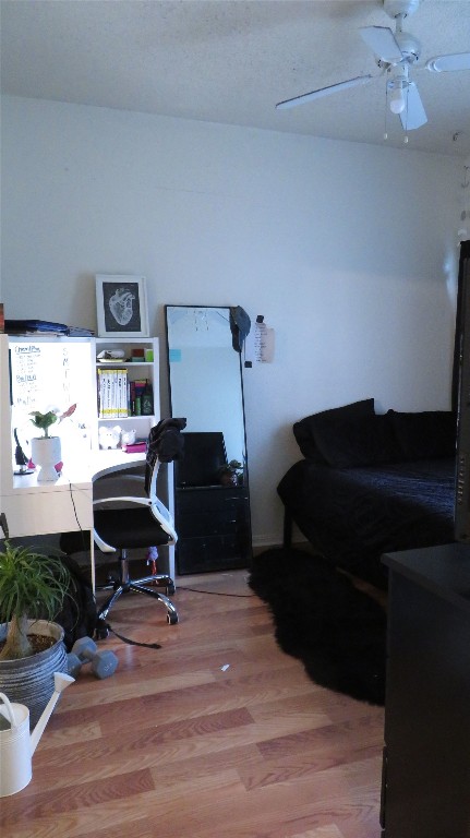 1910 Robbins Place, Unit 202 Austin, TX 78705 - Photo 11 of 15 a bedroom with a bed and a chandelier