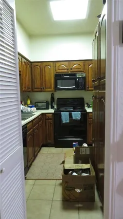 a kitchen with a stove and a microwave
