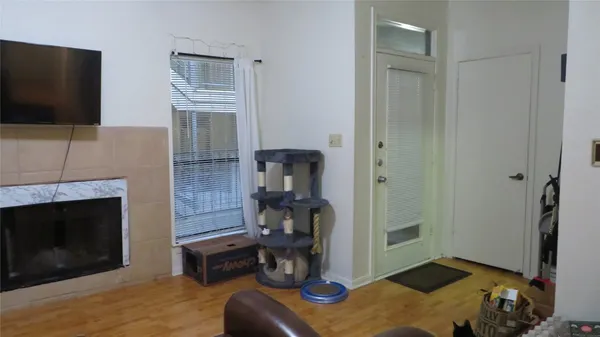 a bedroom with furniture and a fireplace