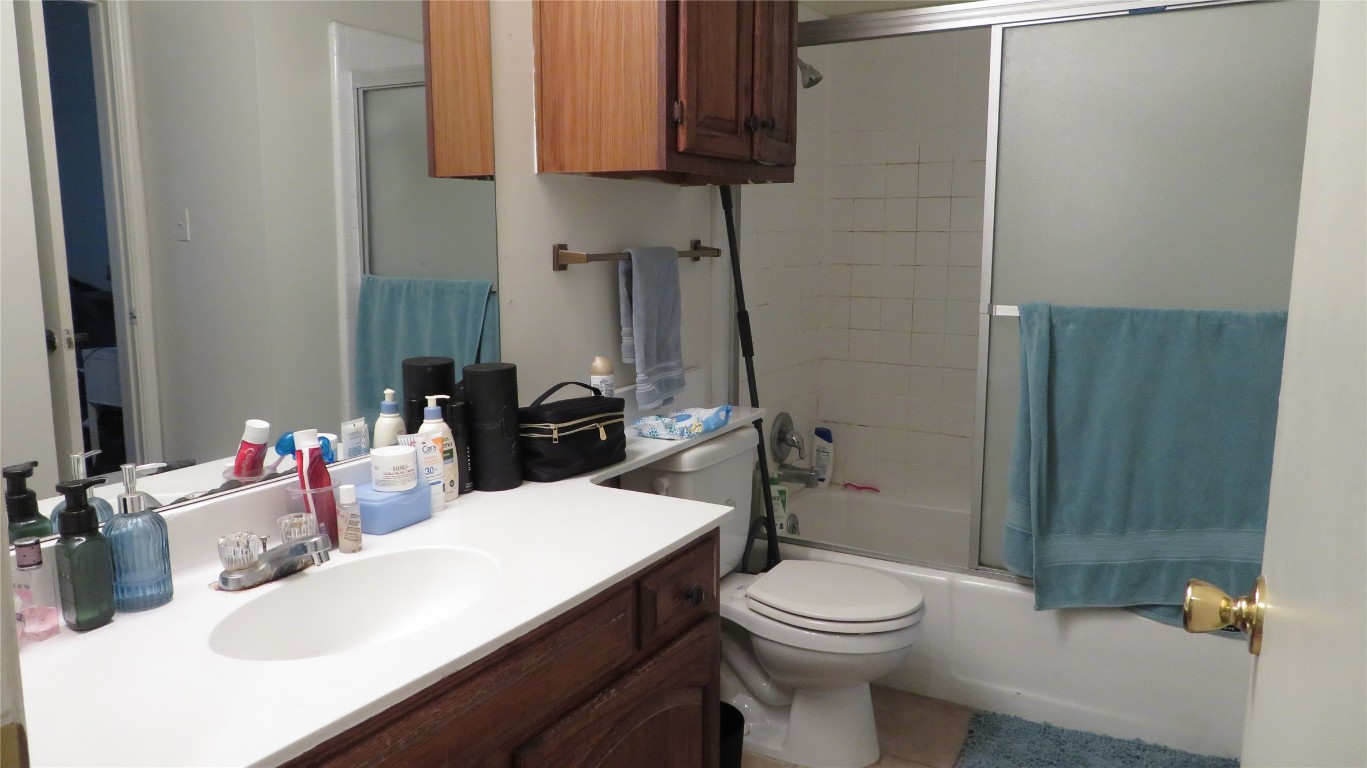 1910 Robbins Place, Unit 202 Austin, TX 78705 - Photo 8 of 15 a bathroom with a sink a toilet and shower