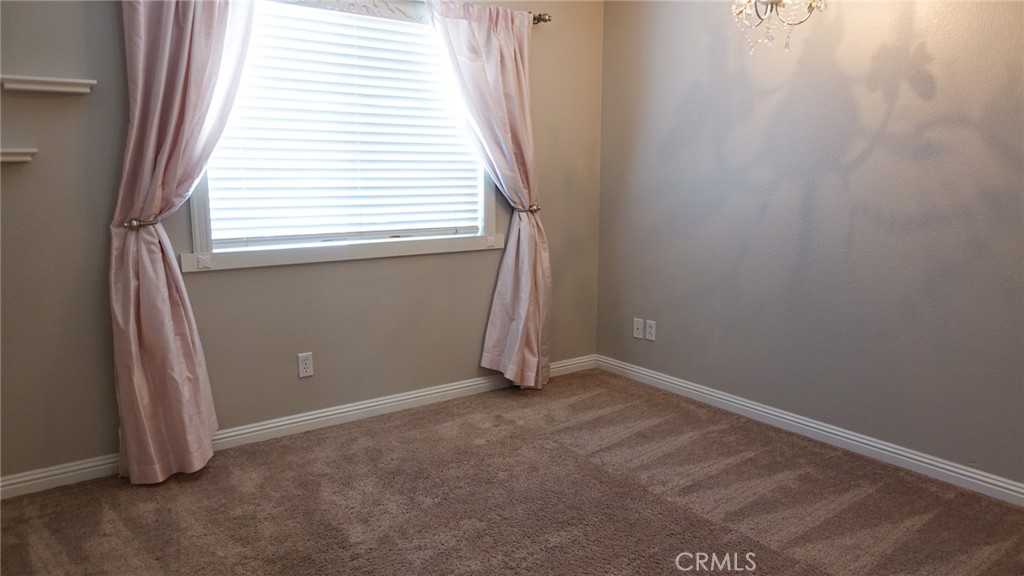 33953 Lily Road Yucaipa, CA 92399 - Photo 14 of 38 an empty room with windows