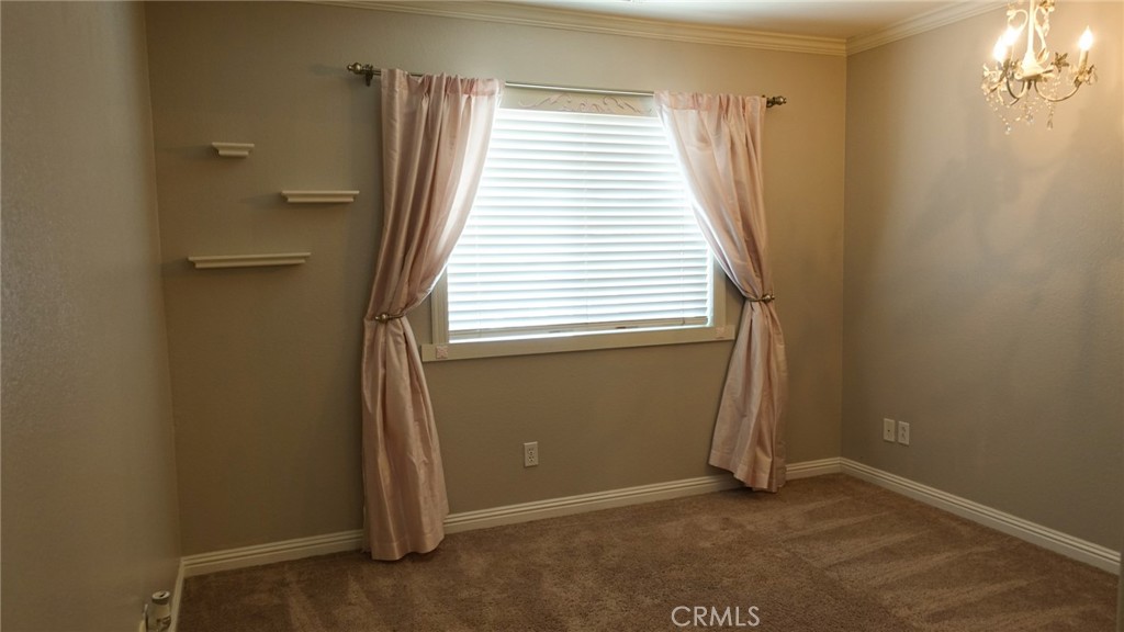 33953 Lily Road Yucaipa, CA 92399 - Photo 16 of 38 an empty room with windows