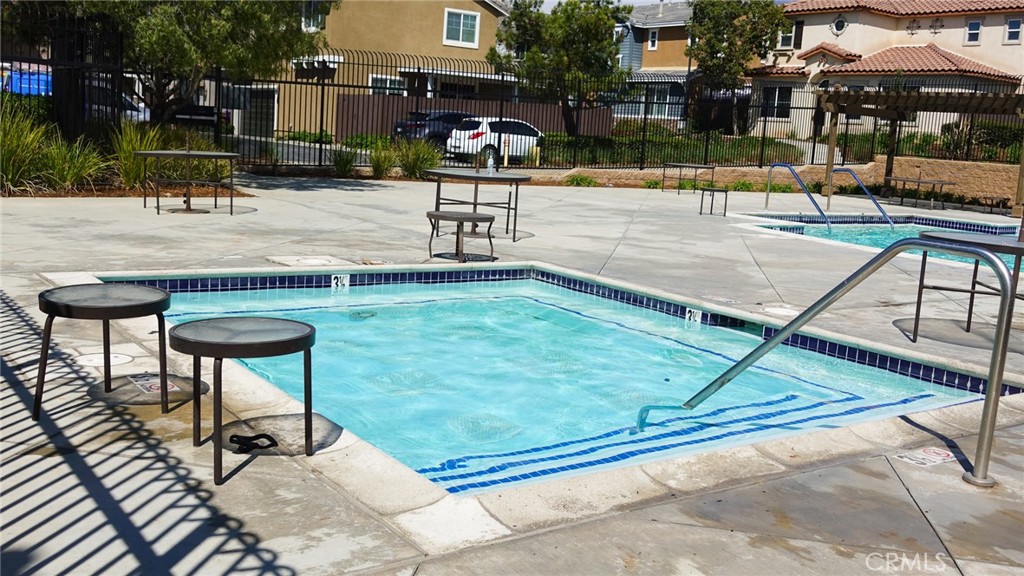 33953 Lily Road Yucaipa, CA 92399 - Photo 31 of 38 a view of a swimming pool with a lounge chair