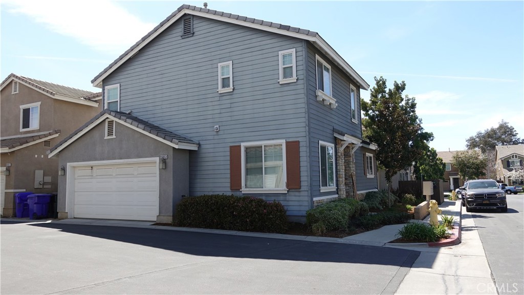 33953 Lily Road Yucaipa, CA 92399 - Photo 37 of 38 a front view of a house with garden