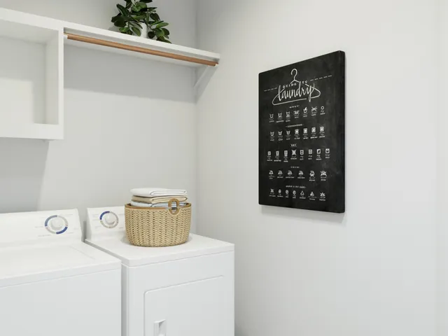 a room with a couch and a view of a mirror