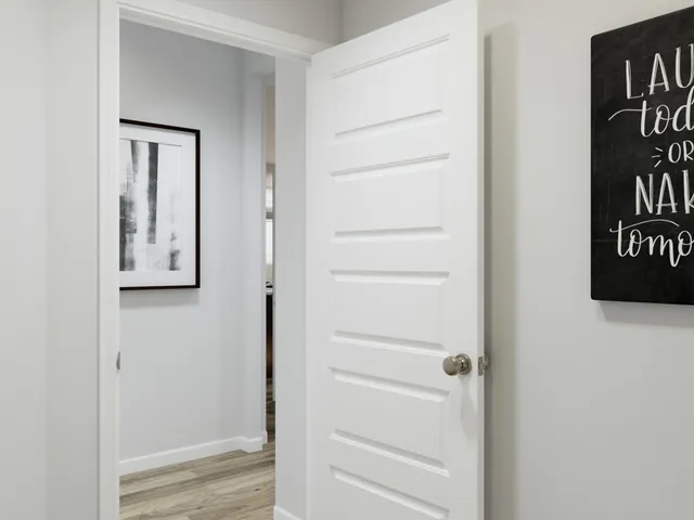 a view of a room with furniture and window
