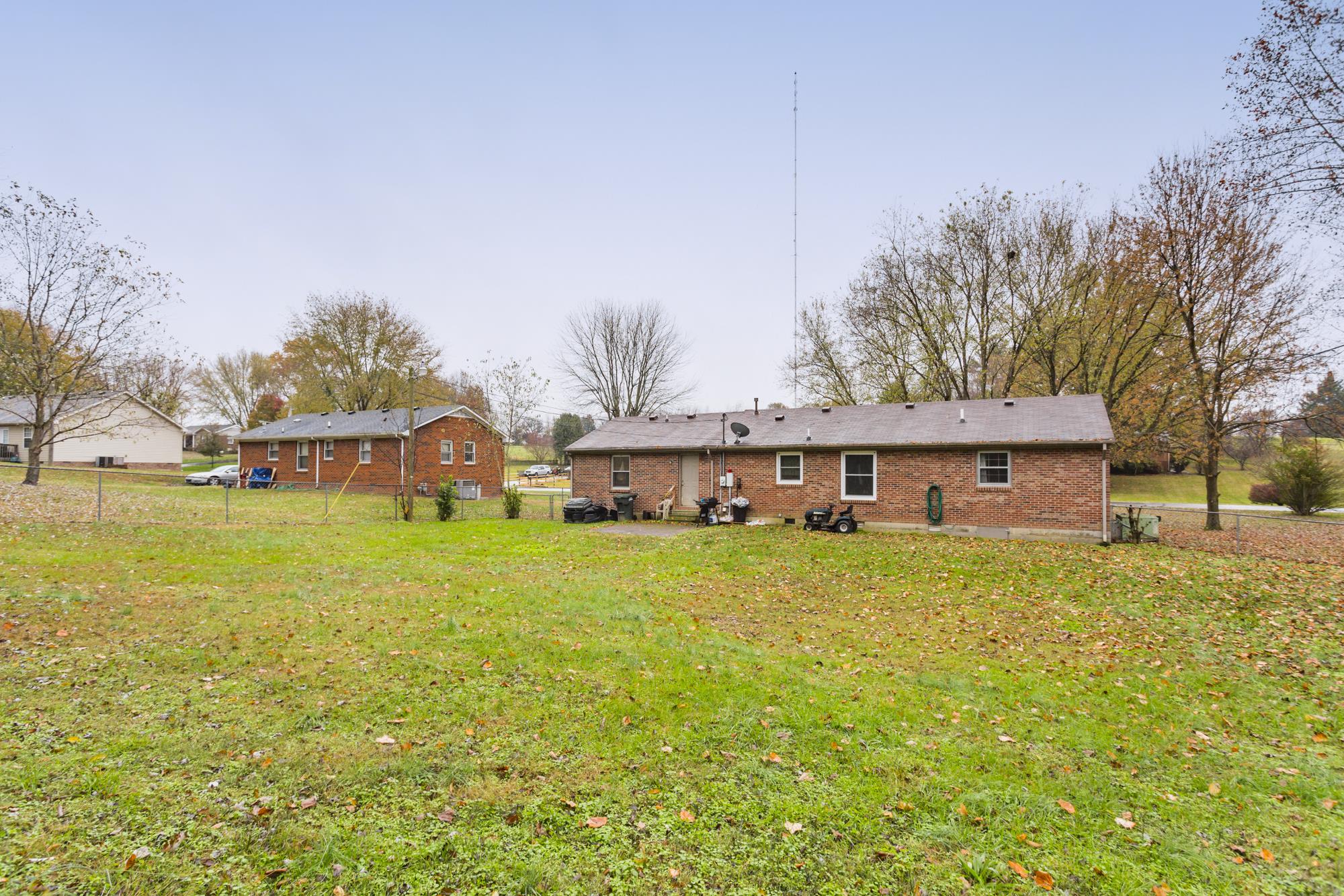 104 Valley Drive Springfield, TN 37172 - Photo 12 of 13 Back of home from fence line...look at all of the space for outside entertaining!