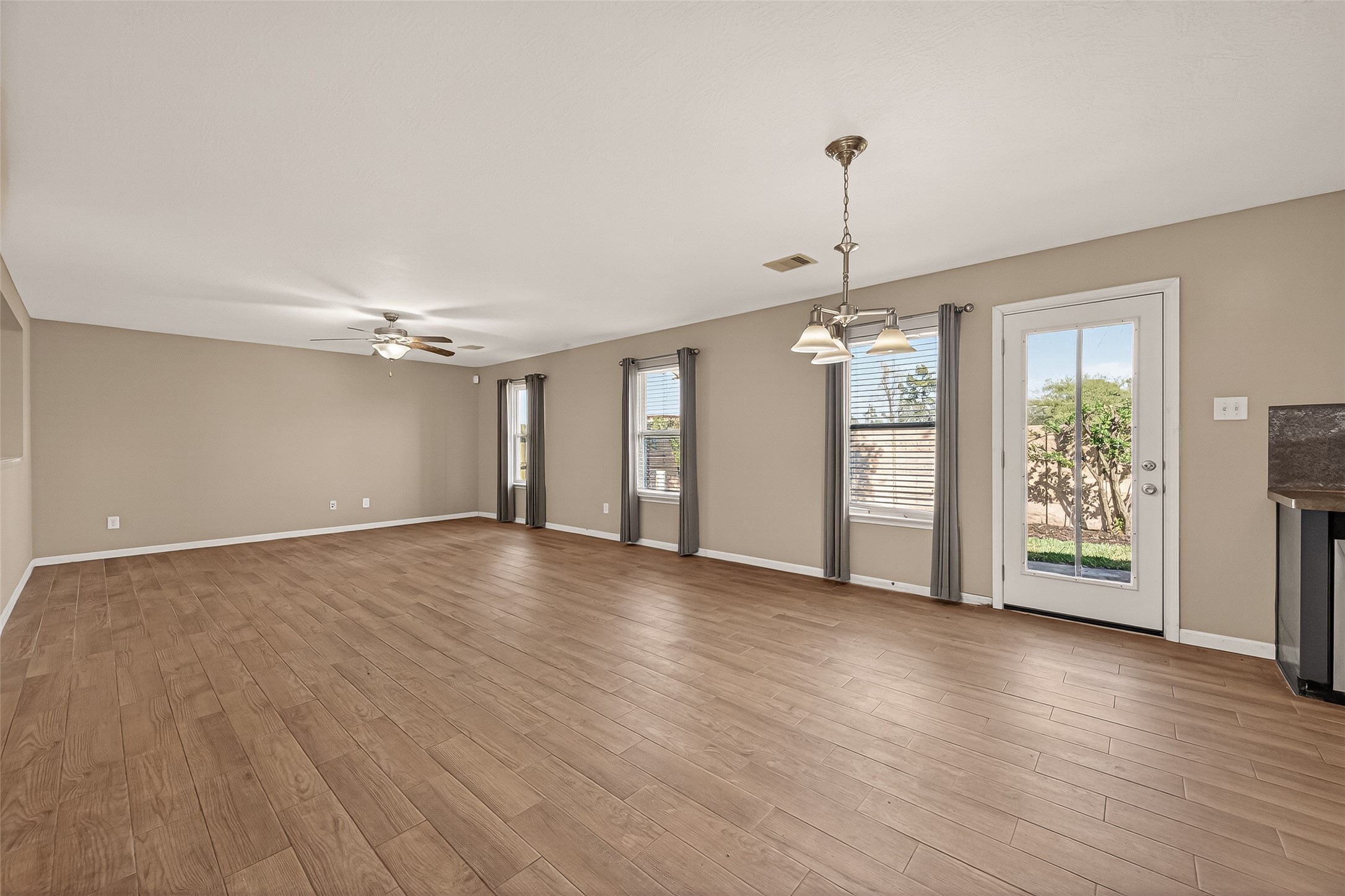 4515 Apache Point Drive Humble, TX 77396 - Photo 11 of 36 a view of an empty room with window and wooden floor
