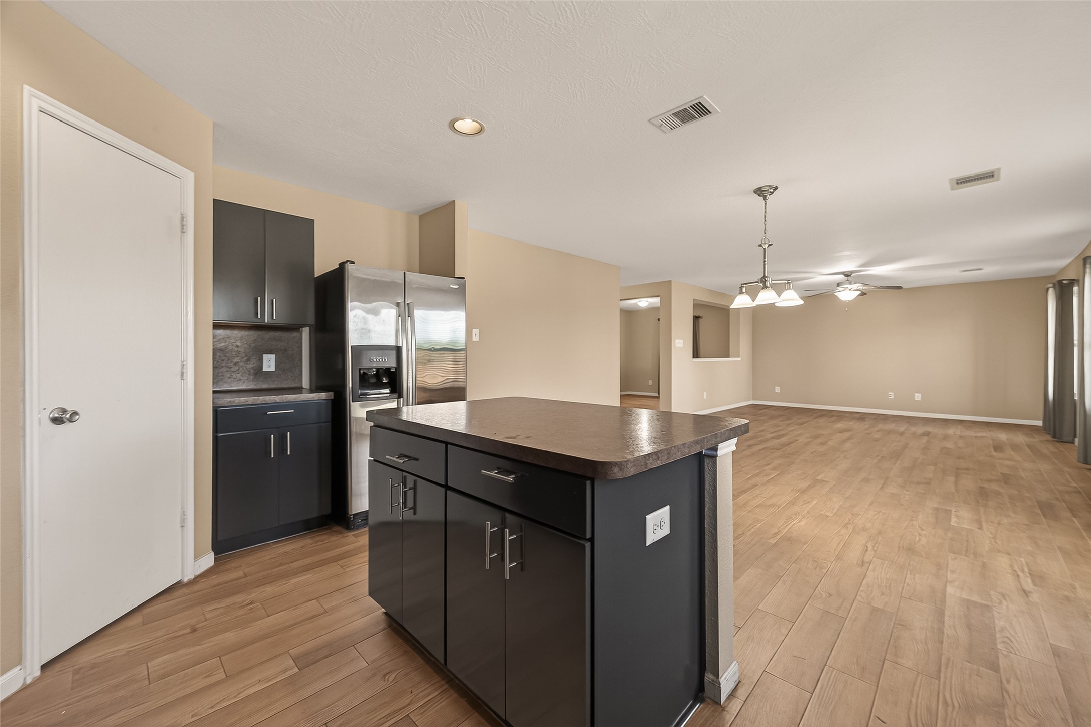 4515 Apache Point Drive Humble, TX 77396 - Photo 14 of 36 a kitchen with stainless steel appliances granite countertop a sink a stove and refrigerator
