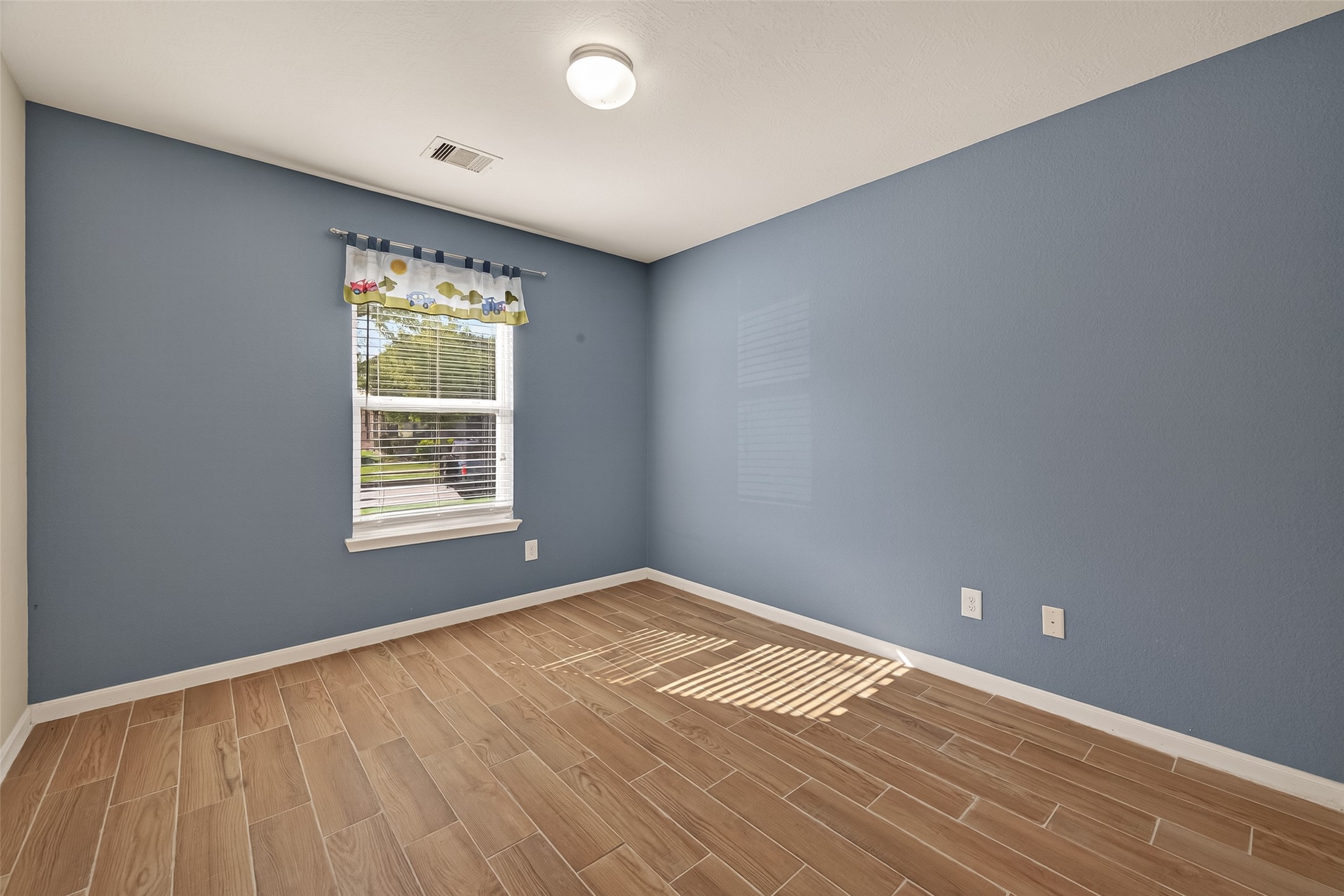 4515 Apache Point Drive Humble, TX 77396 - Photo 17 of 36 an empty room with windows
