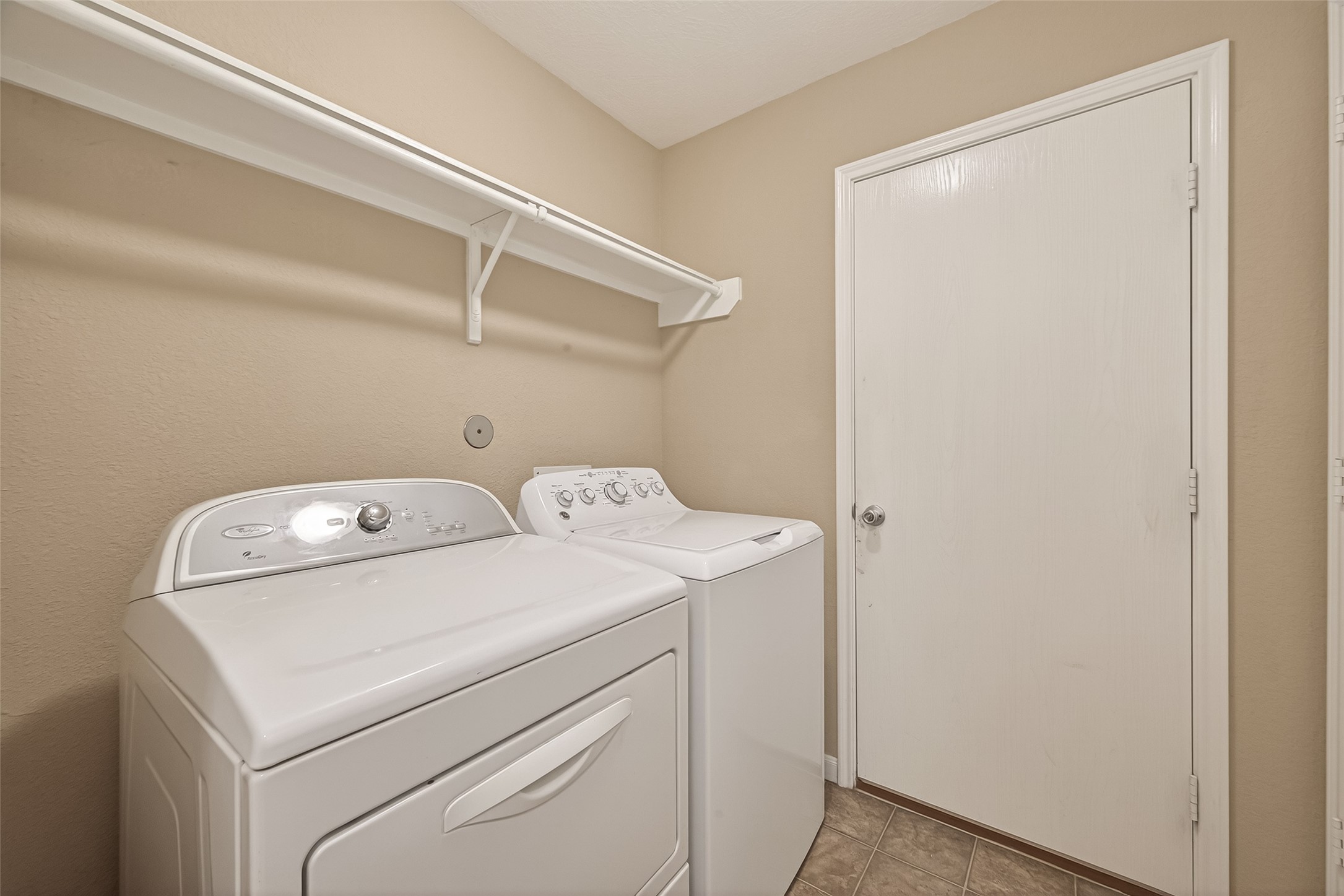 4515 Apache Point Drive Humble, TX 77396 - Photo 25 of 36 a utility room with dryer and washer
