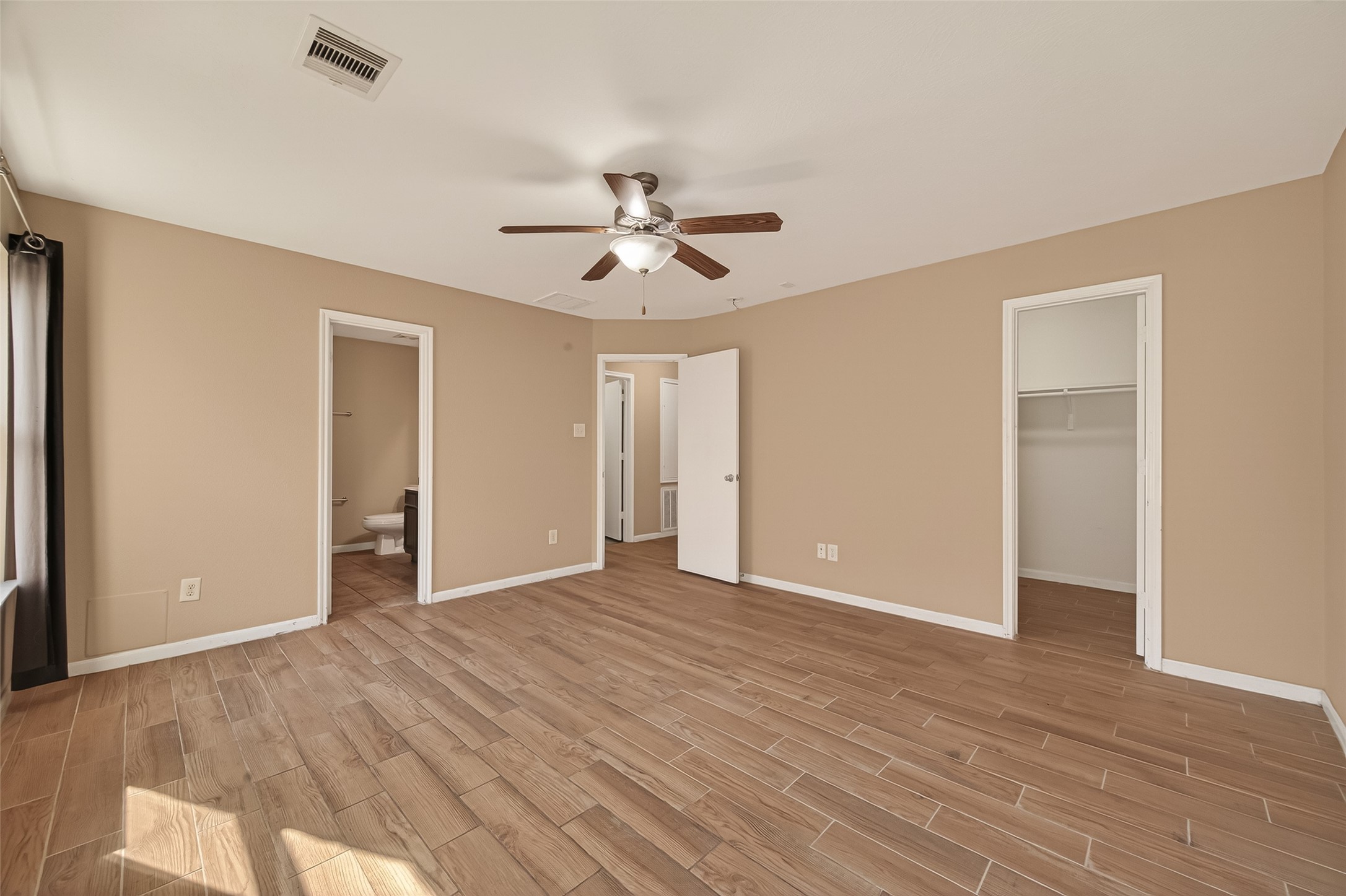 4515 Apache Point Drive Humble, TX 77396 - Photo 28 of 36 wooden floor in an empty room with a window