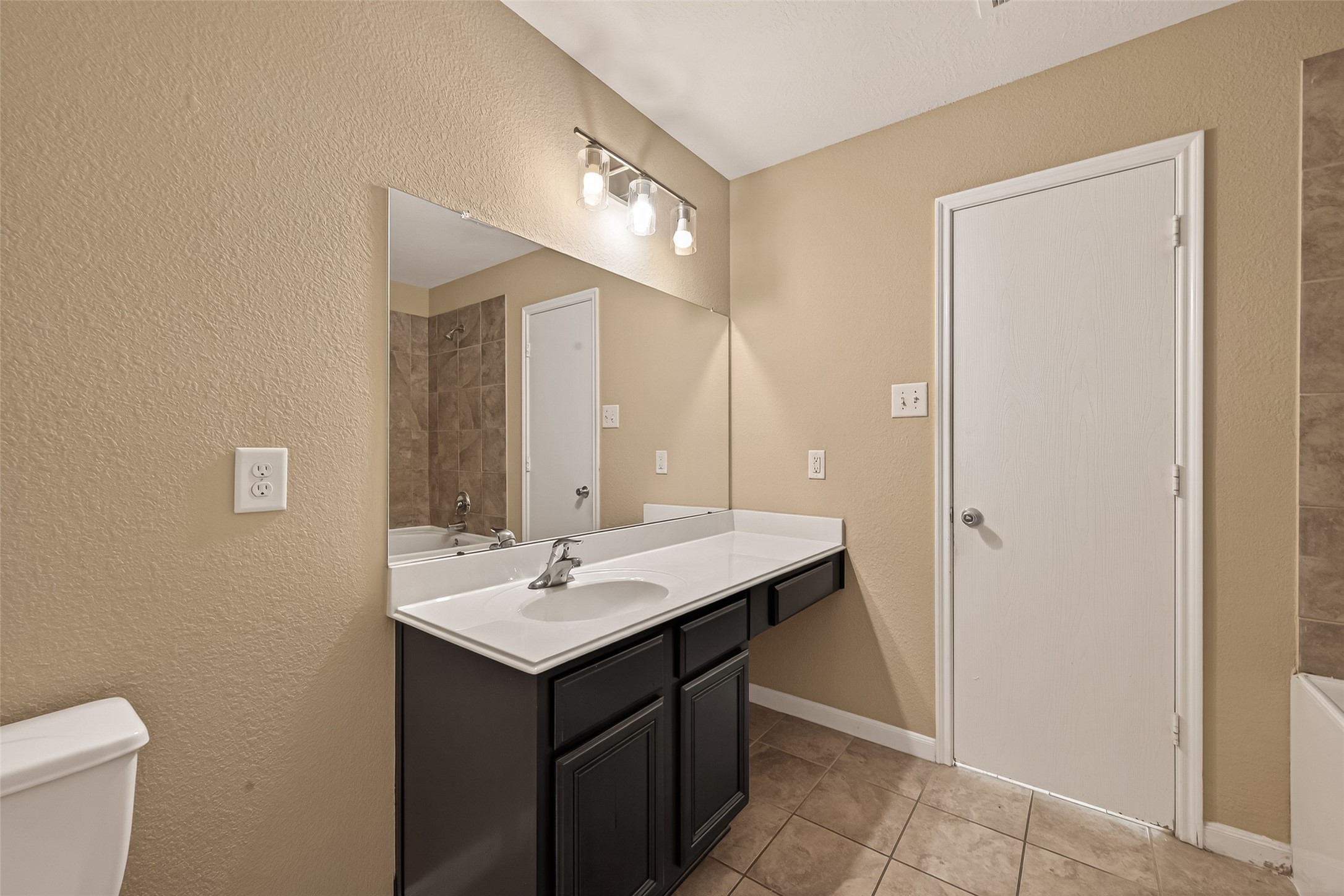 4515 Apache Point Drive Humble, TX 77396 - Photo 30 of 36 a bathroom with a sink and a mirror