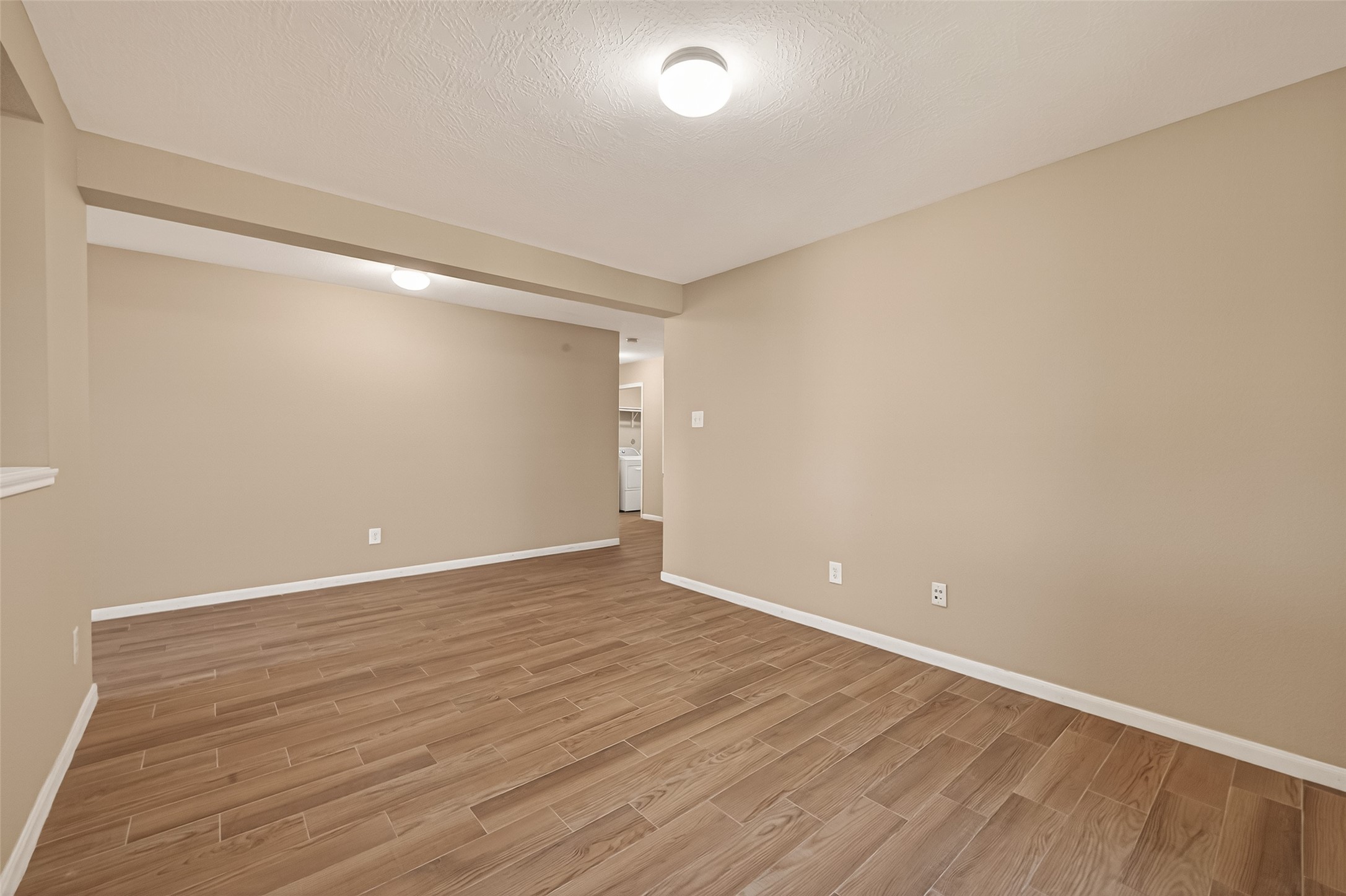 4515 Apache Point Drive Humble, TX 77396 - Photo 6 of 36 a view of an empty room with wooden floor