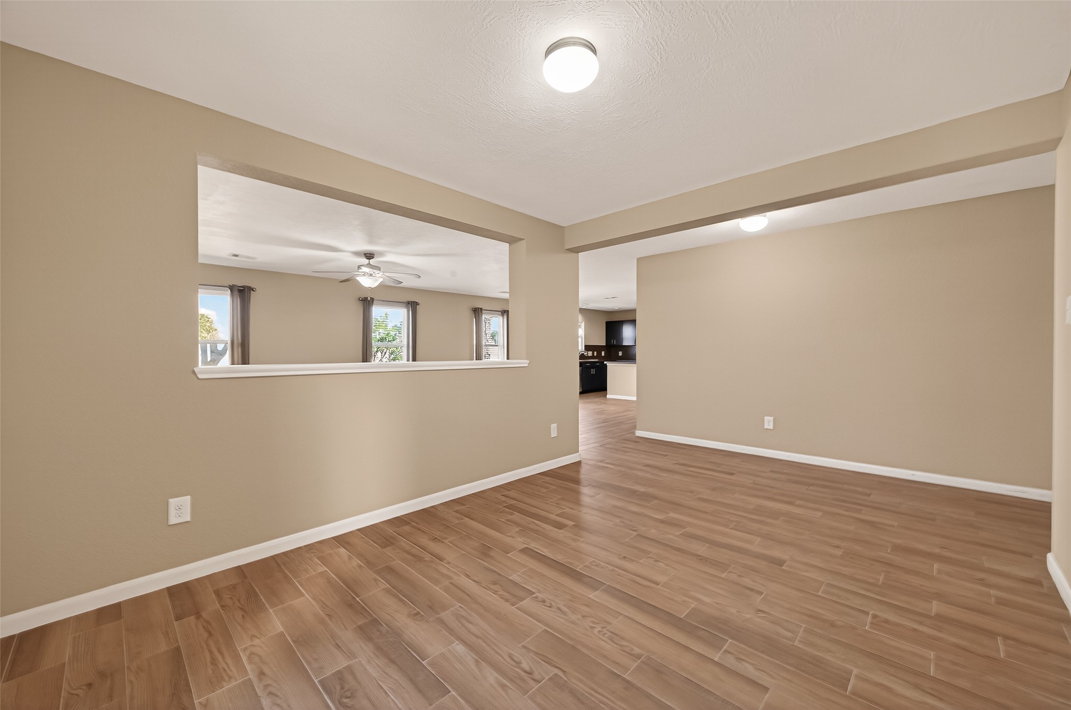 4515 Apache Point Drive Humble, TX 77396 - Photo 7 of 36 wooden floor in an empty room with a window