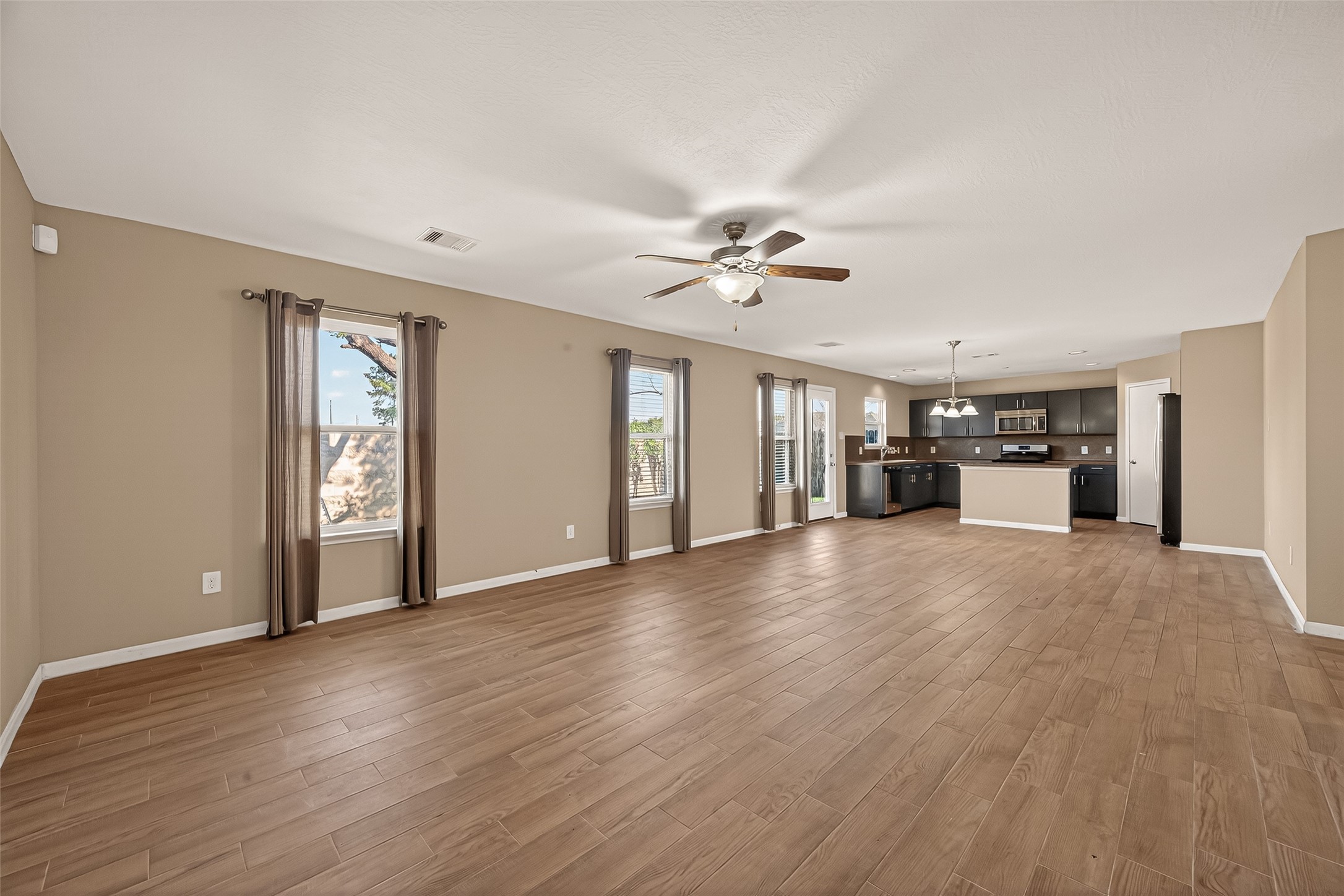 4515 Apache Point Drive Humble, TX 77396 - Photo 8 of 36 a view of an empty room with window and cabinet