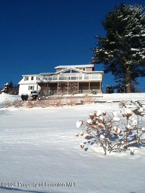 338 Point Road Factoryville, PA 18419 - Photo 21 of 55 a view of a building with snow on the road