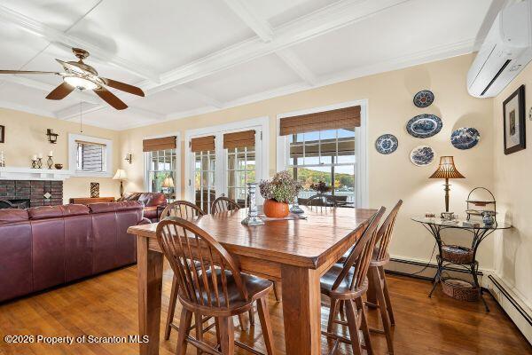 338 Point Road Factoryville, PA 18419 - Photo 25 of 55 a view of a dining room and livingroom with furniture wooden floor a rug and a chandelier