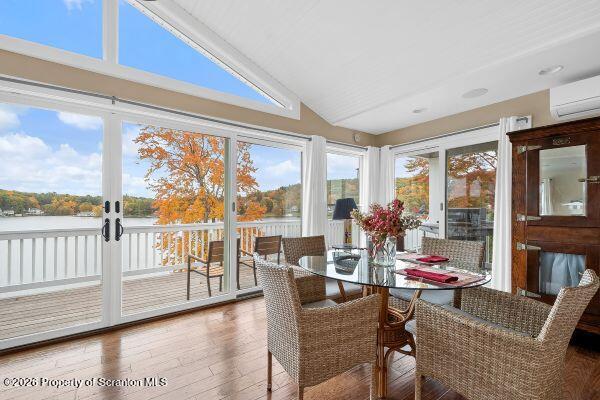 338 Point Road Factoryville, PA 18419 - Photo 31 of 55 a living room with furniture and a floor to ceiling window