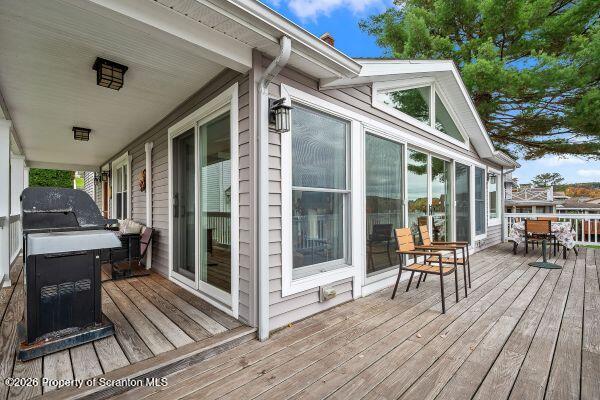 338 Point Road Factoryville, PA 18419 - Photo 7 of 55 a view of a patio with table and chairs and wooden floor