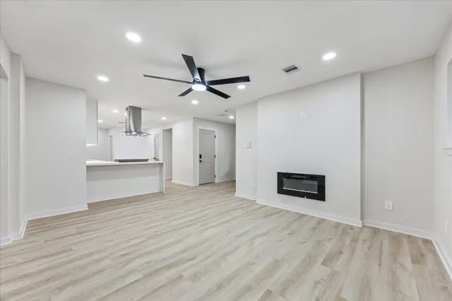 a view of a kitchen with a sink and a refrigerator