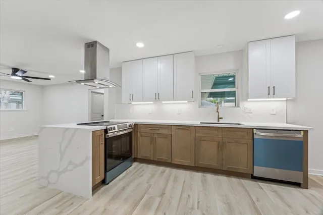 a kitchen with a sink cabinets and window