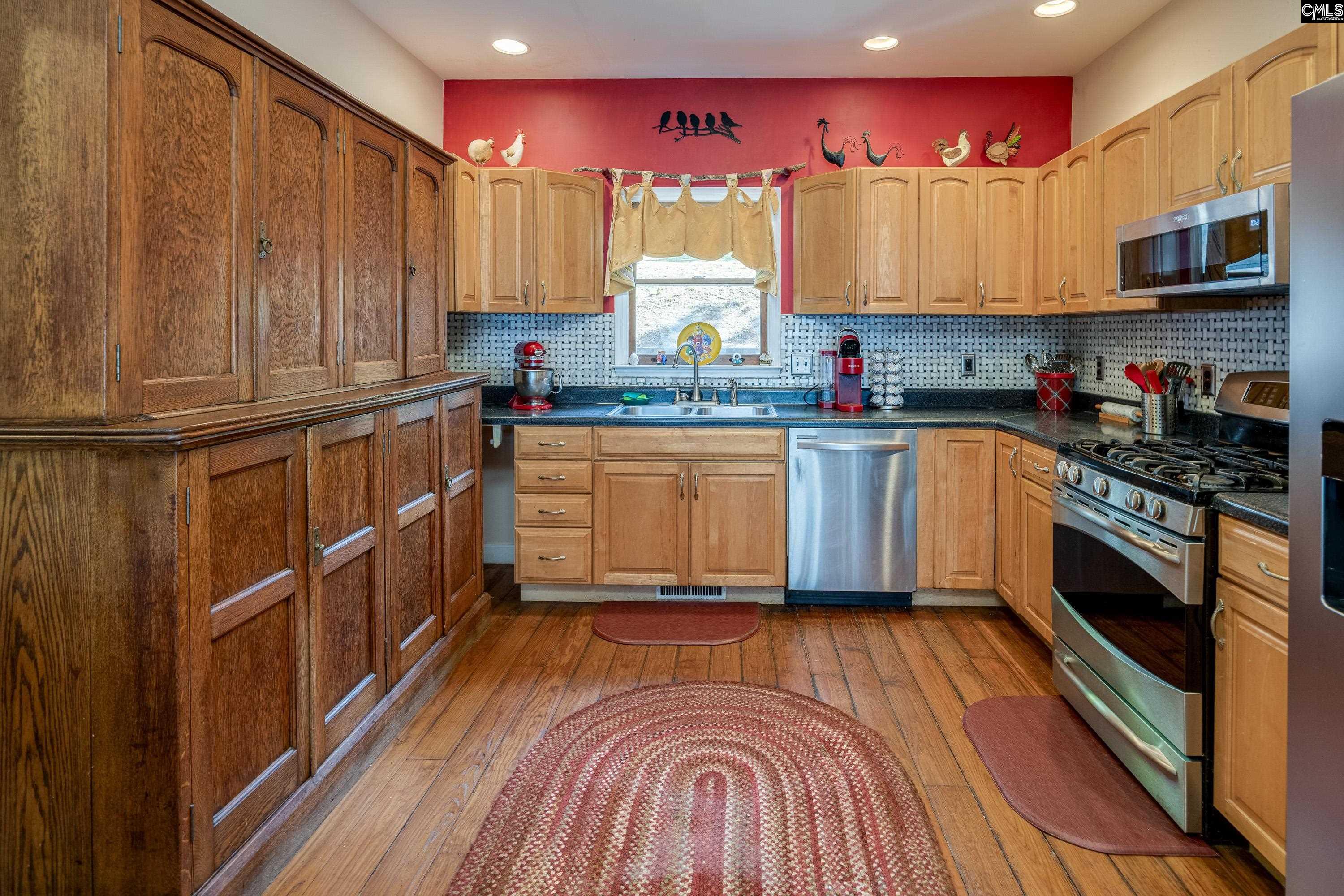 2577 Harbor View Road Camden, SC 29020 - Photo 21 of 42 a kitchen with stainless steel appliances granite countertop a stove a sink and a microwave