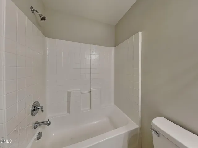 a spacious bathroom with a double vanity sink mirror and