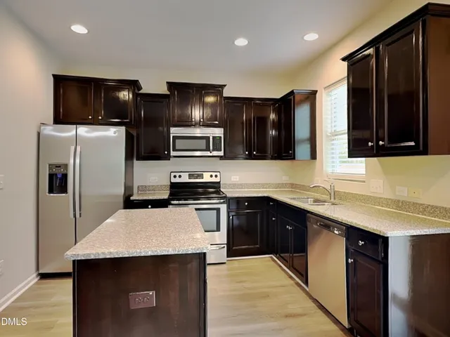 a view of livingroom with hardwood floor and hallway
