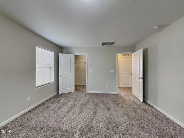 a kitchen with stainless steel appliances wooden cabinets a sink and a stove