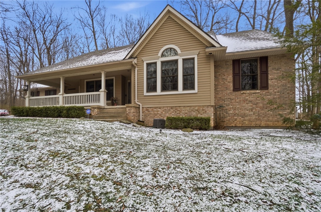 5300 Brookshire Lane Springfield, OH 45502 - Photo 2 of 56 This charming home features a welcoming porch, brick and siding exterior, and classic window accents.
