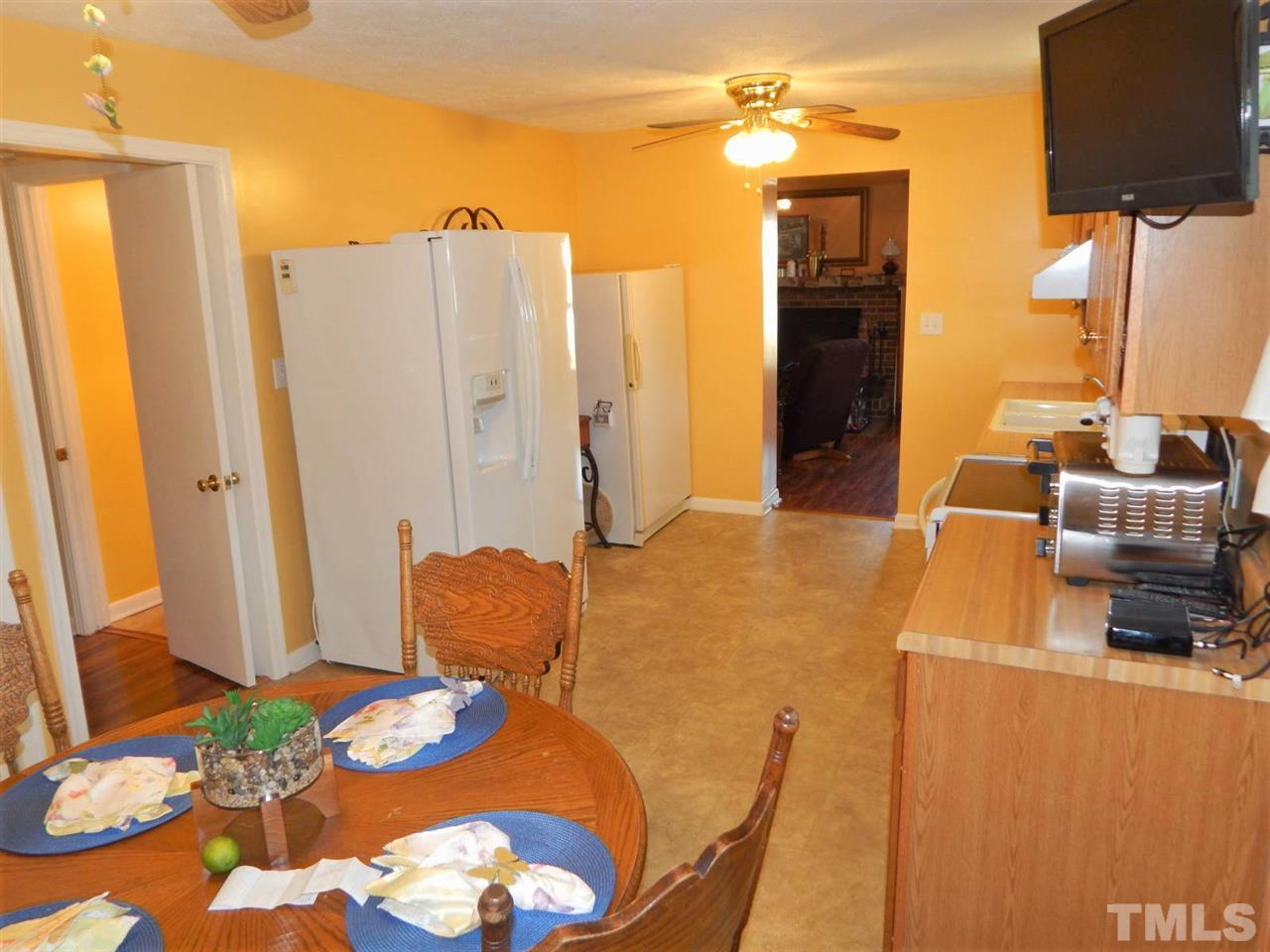 218 John Street Roxboro, NC 27573 - Photo 9 of 25 a living room with furniture and a flat screen tv