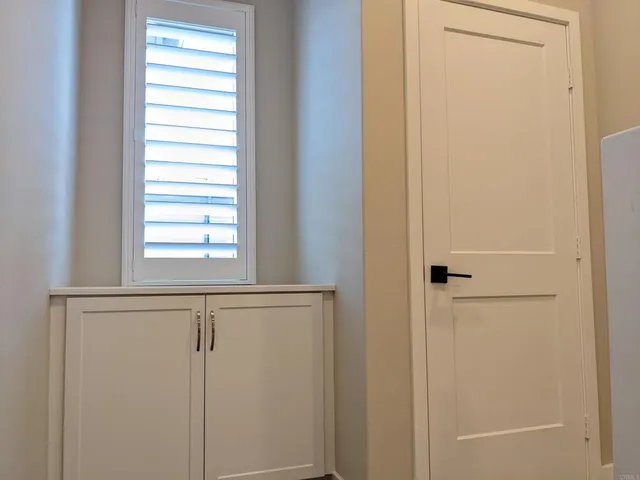 a view of a bathroom from a hallway