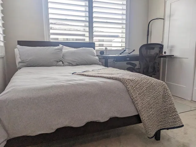 a white toilet sitting next to a bathroom sink