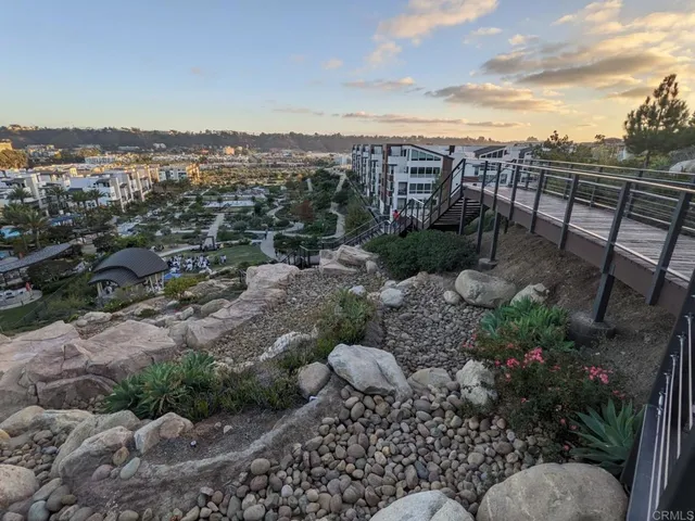 a aerial view of a house with garden space and sitting area