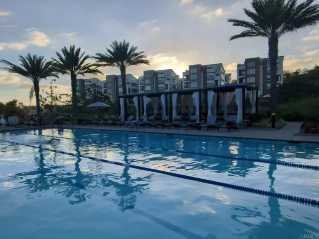a view of outdoor space with seating area and swimming pool