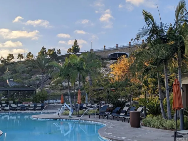 a view of a swimming pool with a yard