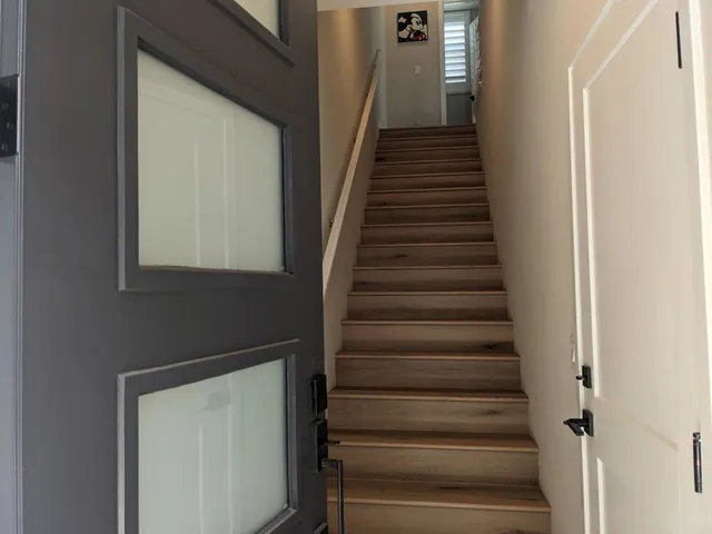 a living room with fireplace furniture and a flat screen tv