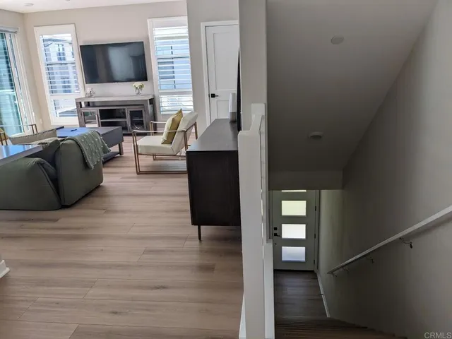 a kitchen with a stove a sink a dining table and chairs