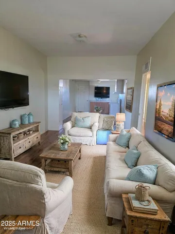 a living room with furniture and a flat screen tv