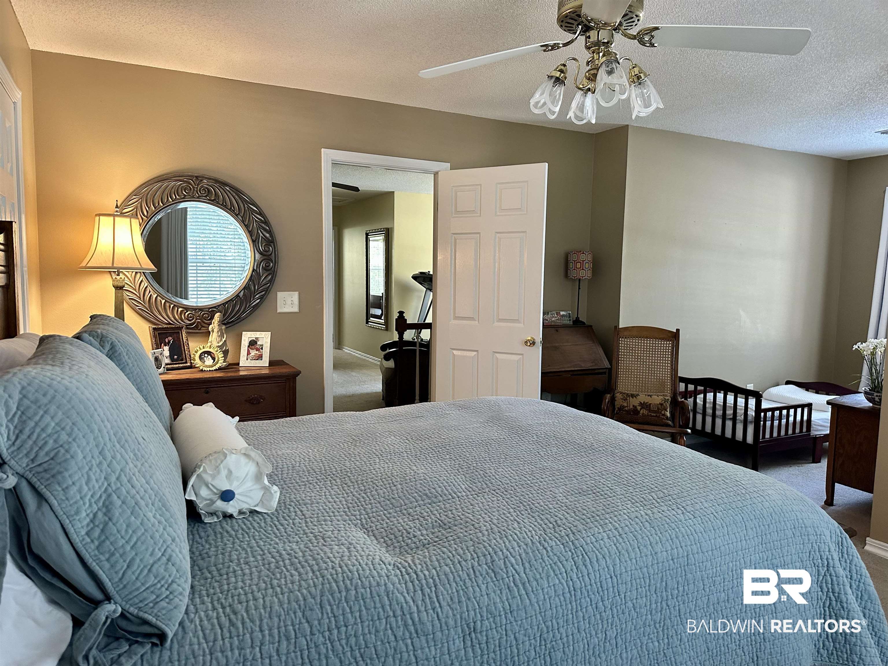 148 Brooks Boulevard Brewton, AL 36426 - Photo 25 of 45 Bedroom featuring a textured ceiling, a ceiling fan, and carpet floors