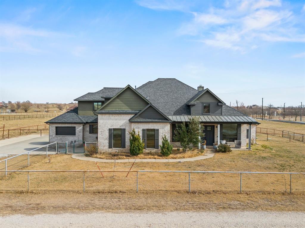 13688 Jackson Road Ponder, TX 76259 - Photo 1 of 20 a front view of a house with a garden